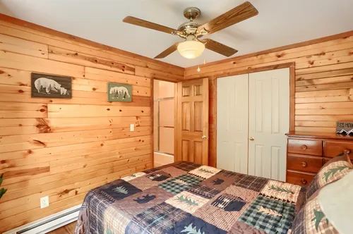 The bedroom with a queen bed.